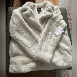 White faux fur coat